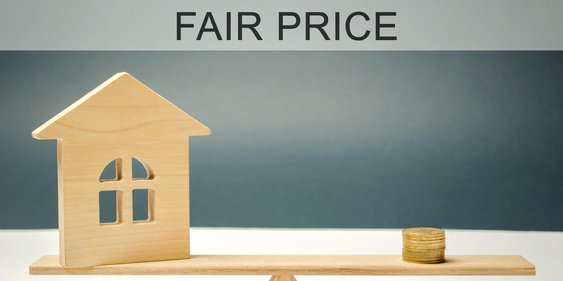 coins and house on the scales with the words Fair price